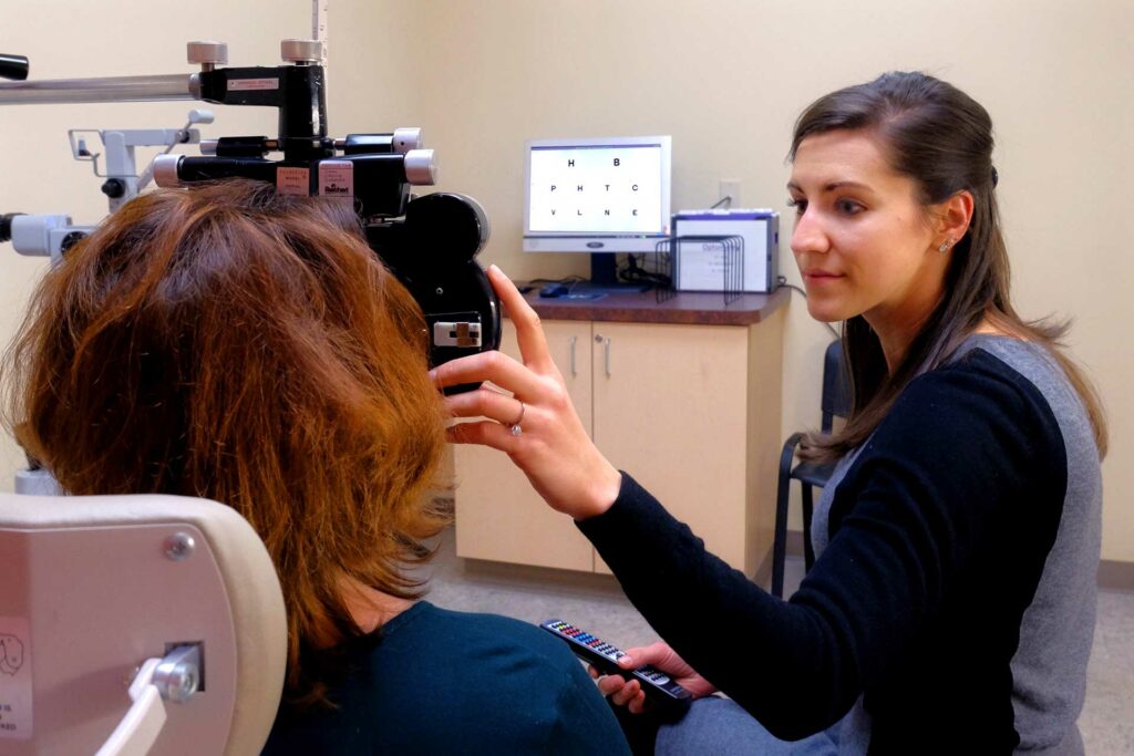 Patient having her eyes examined at Ross Eye Institute